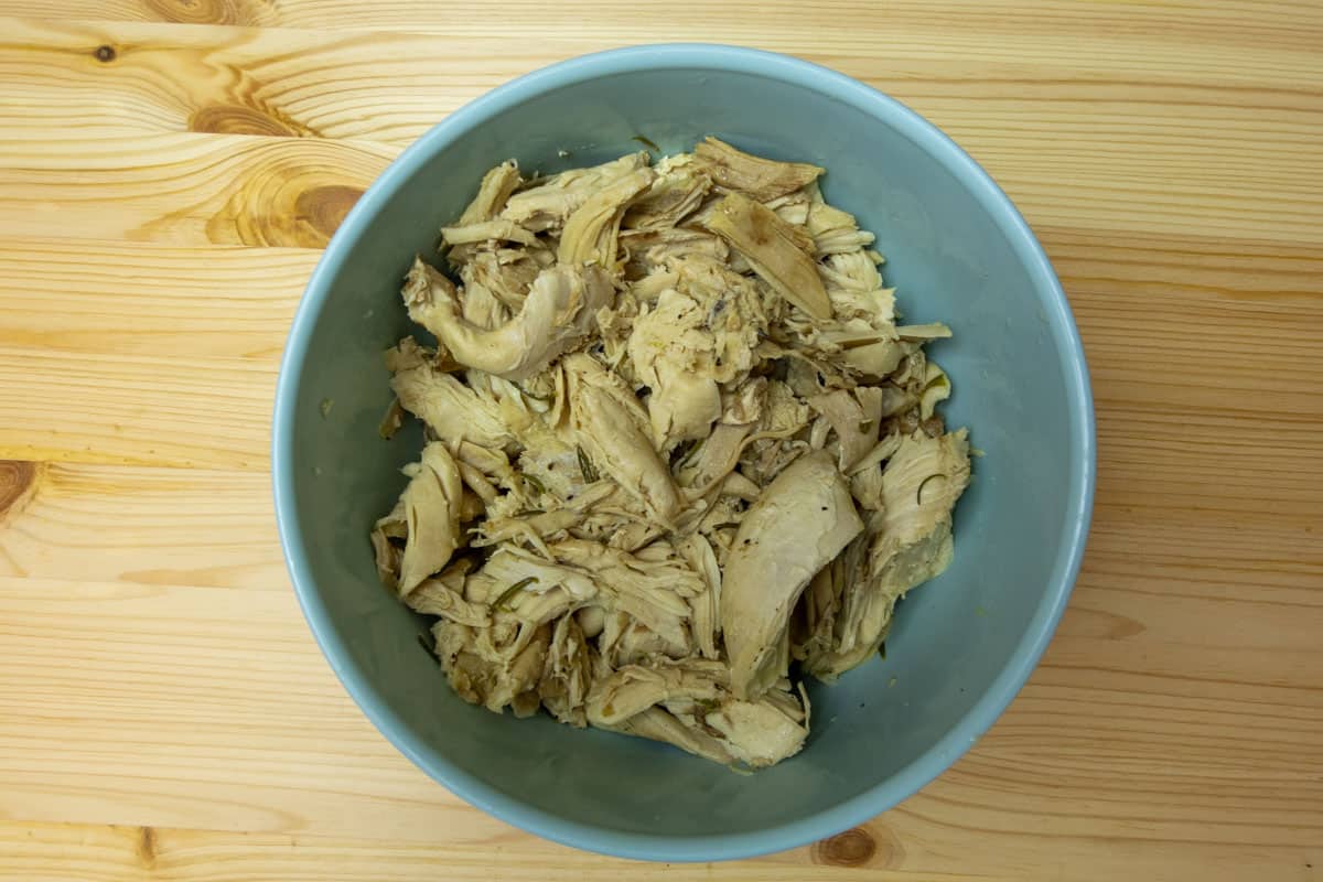 Blue bowl with shredded chicken