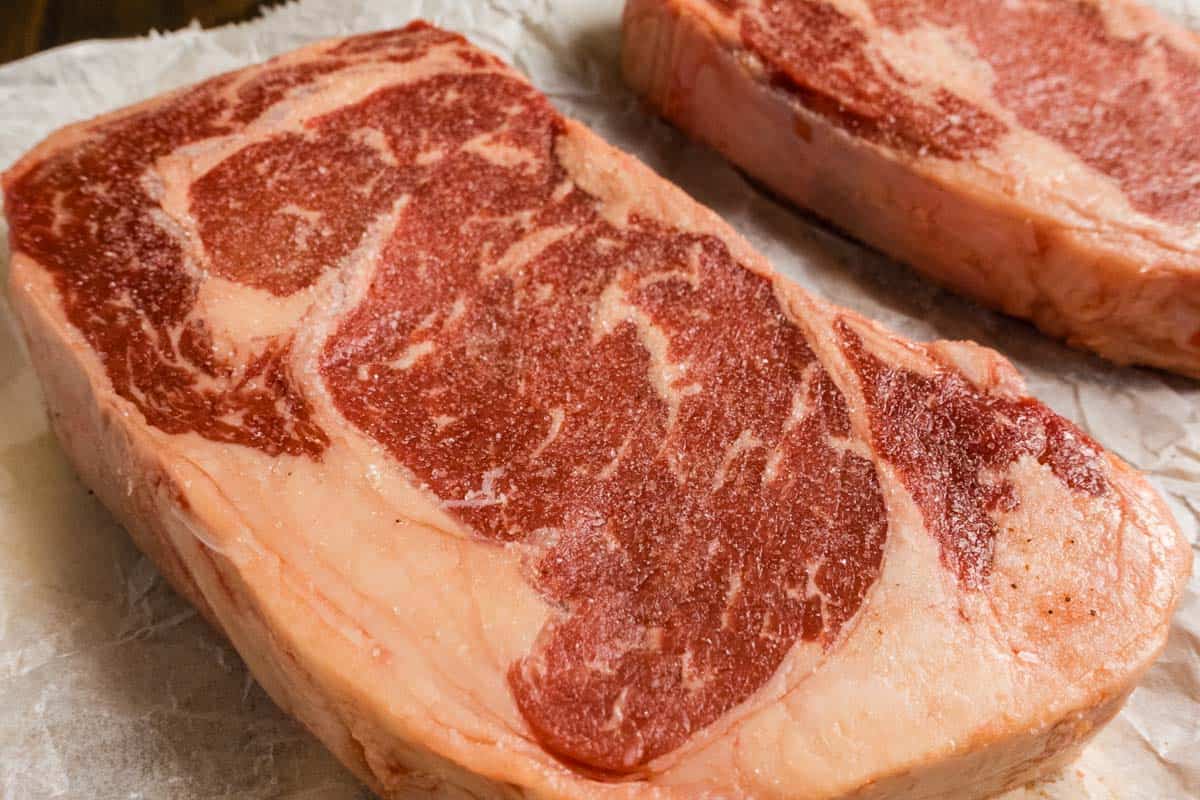 Steak with salt freshly added.
