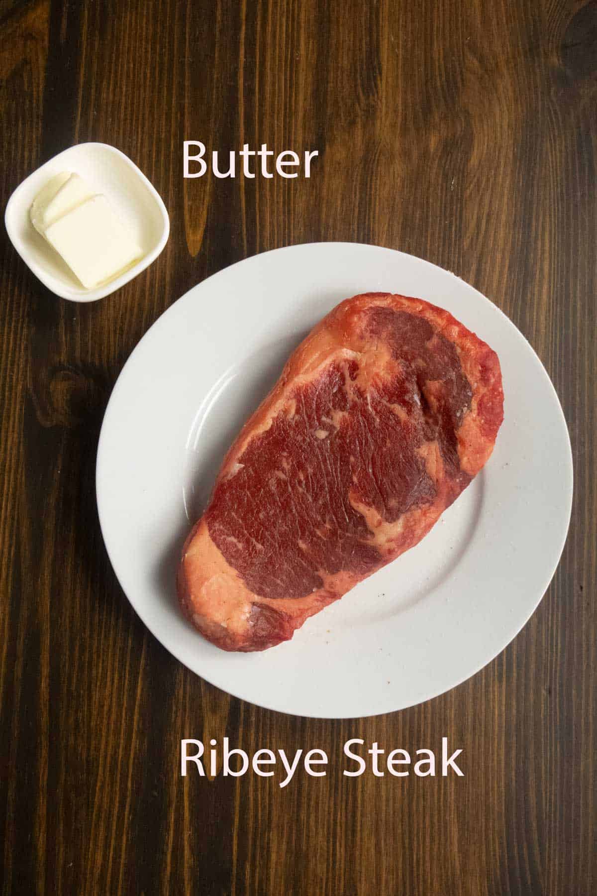 Ingredient shot of steak and butter.