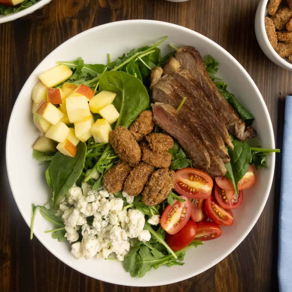 Arugula and Spinach Salad with Steak with ingredients lined up.
