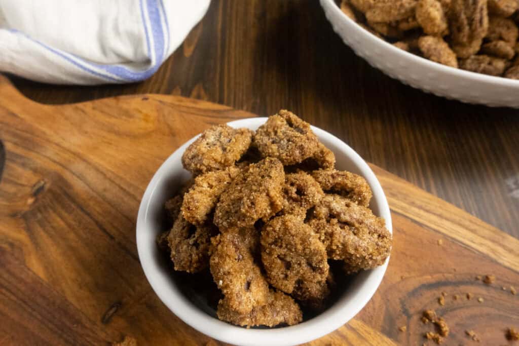Cinnamon sugar pecans in a bowl on the table ready to serve. 
