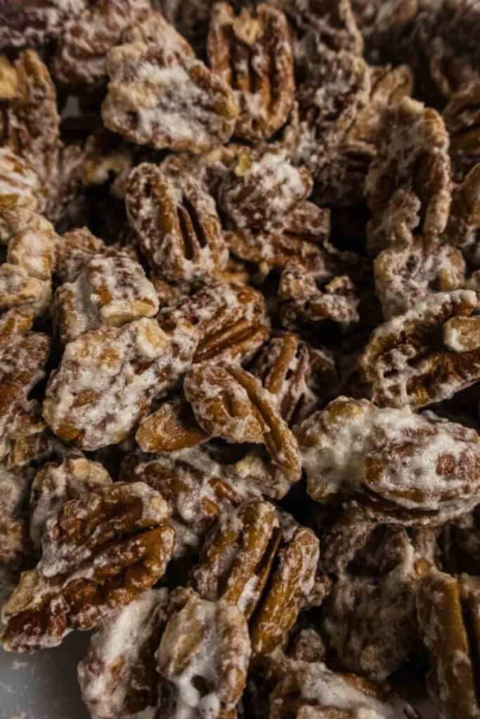 Pecans coated in frothy egg whites.