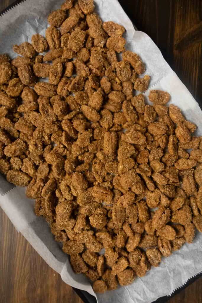Pecans tossed in cinnamon sugar before baking.