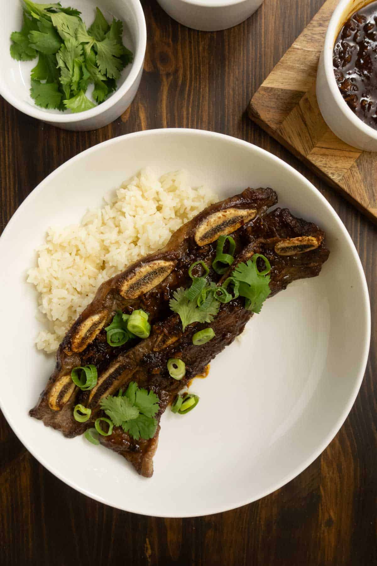 Ribs and rice on a plate ready to be served.