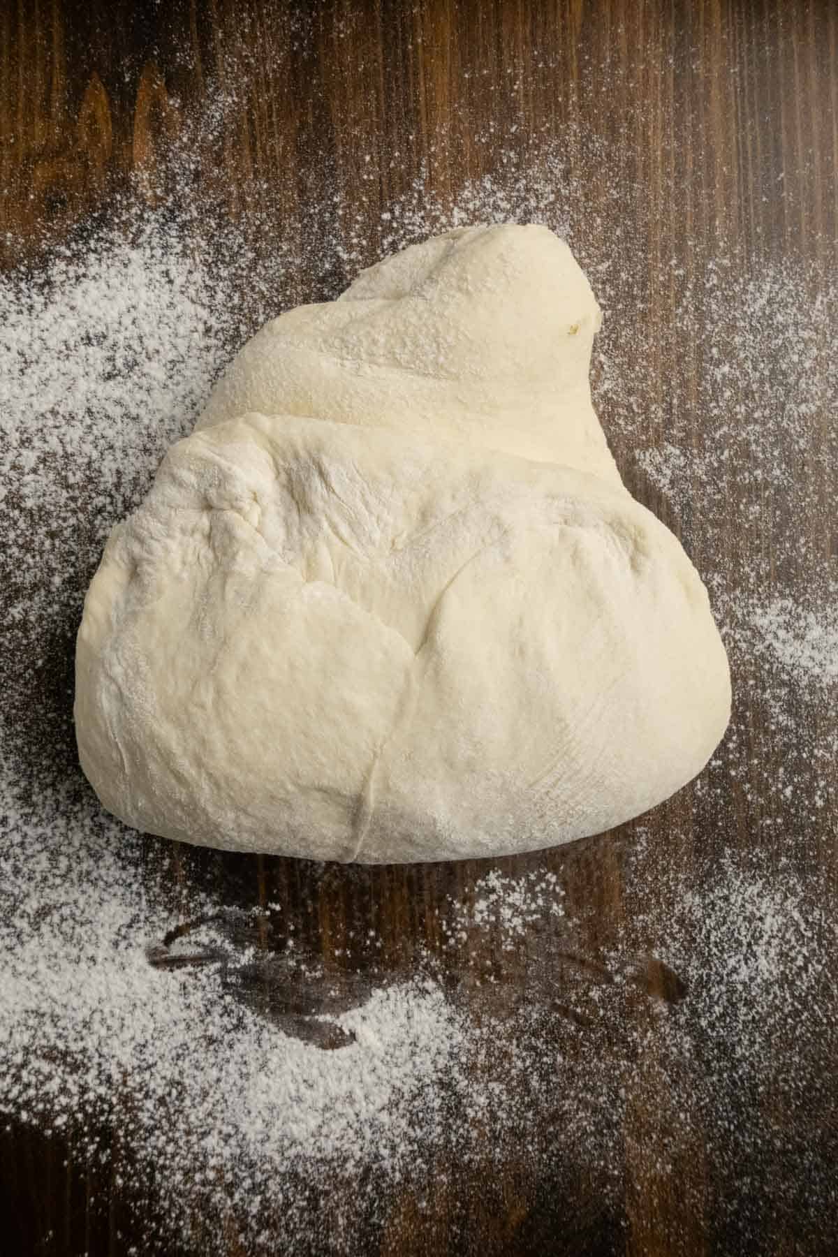 Letter folding the dough by folding the bottom third up.