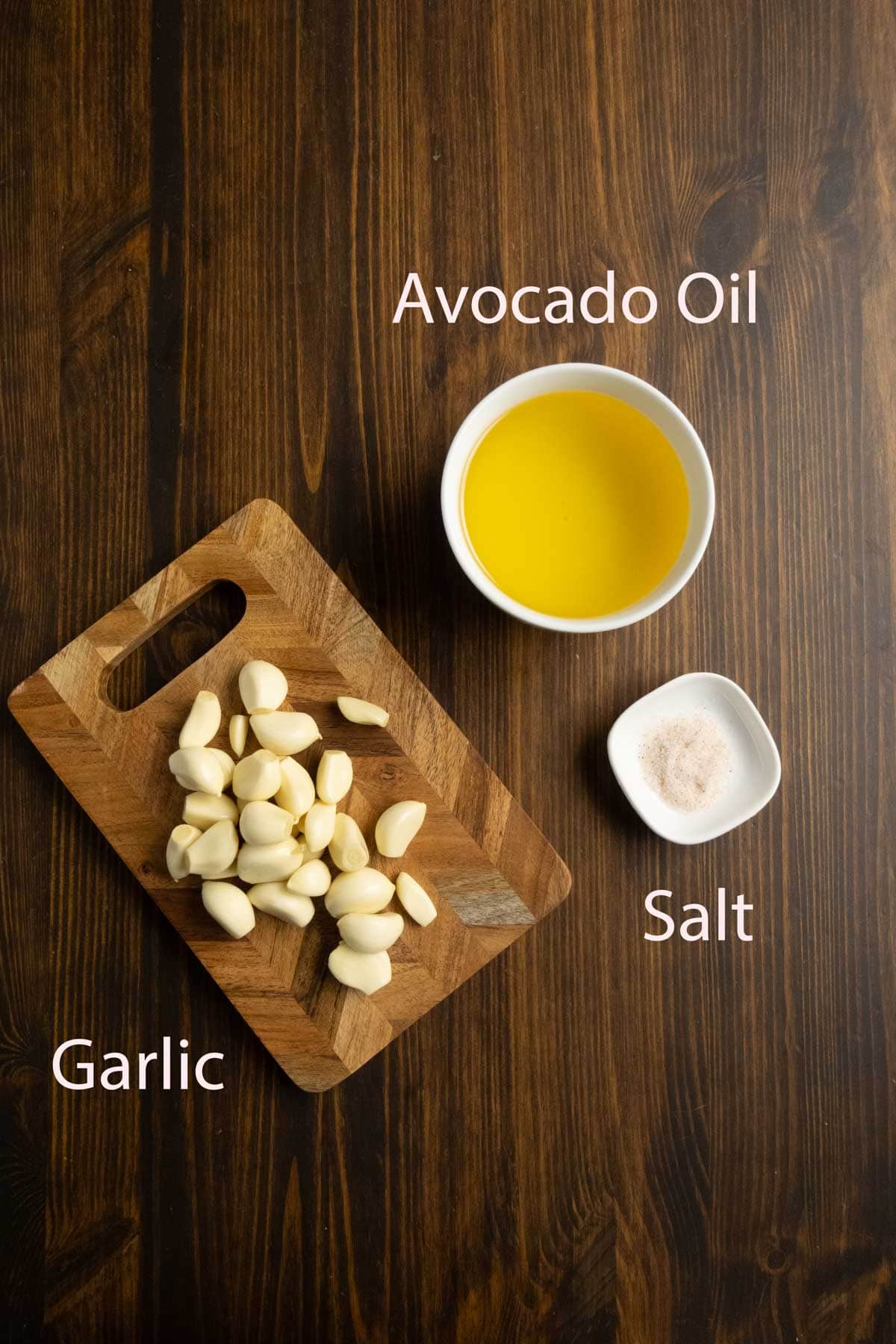 Ingredient shot of garlic, avocado oil, and salt.