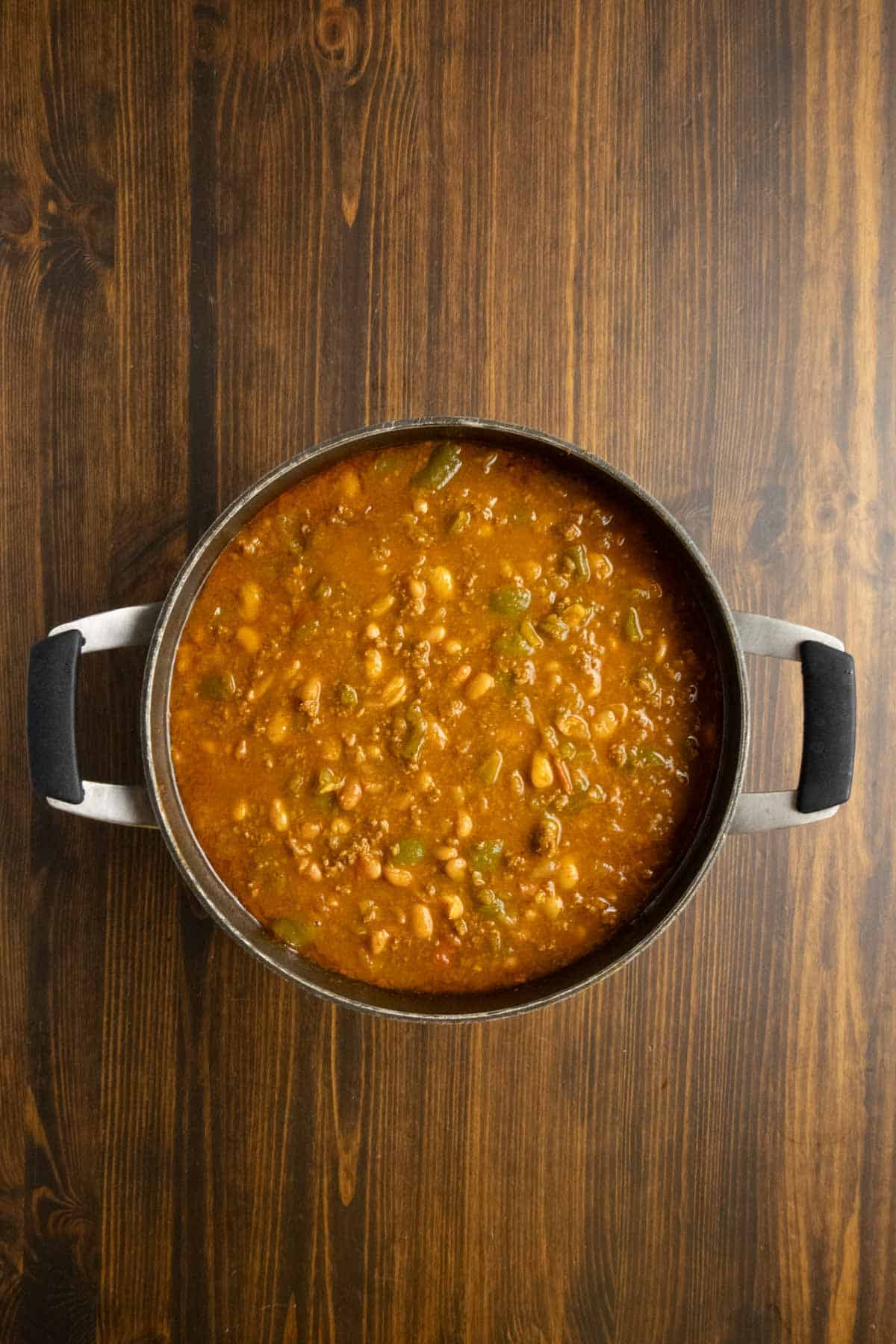 A pot of chili that is ready to be served.