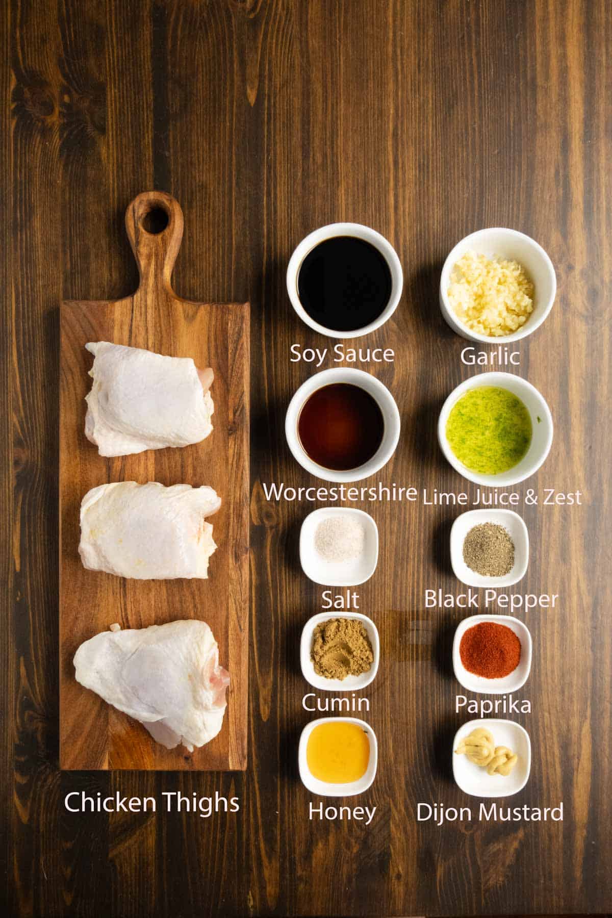 Ingredient shot of Peruvian chicken including chicken thighs, soy sauce, Worcestershire, and spices.