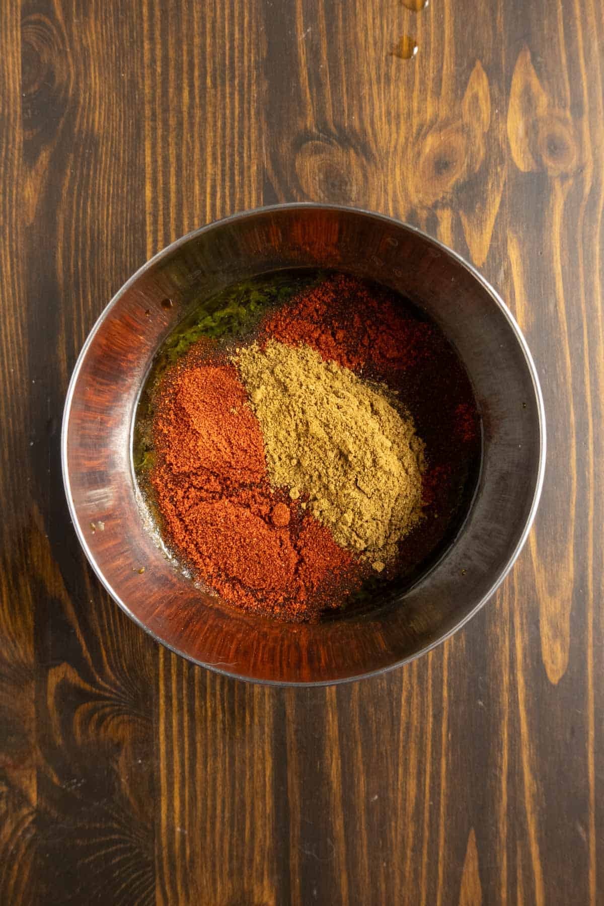 A bowl of marinade ingredients before stirring.