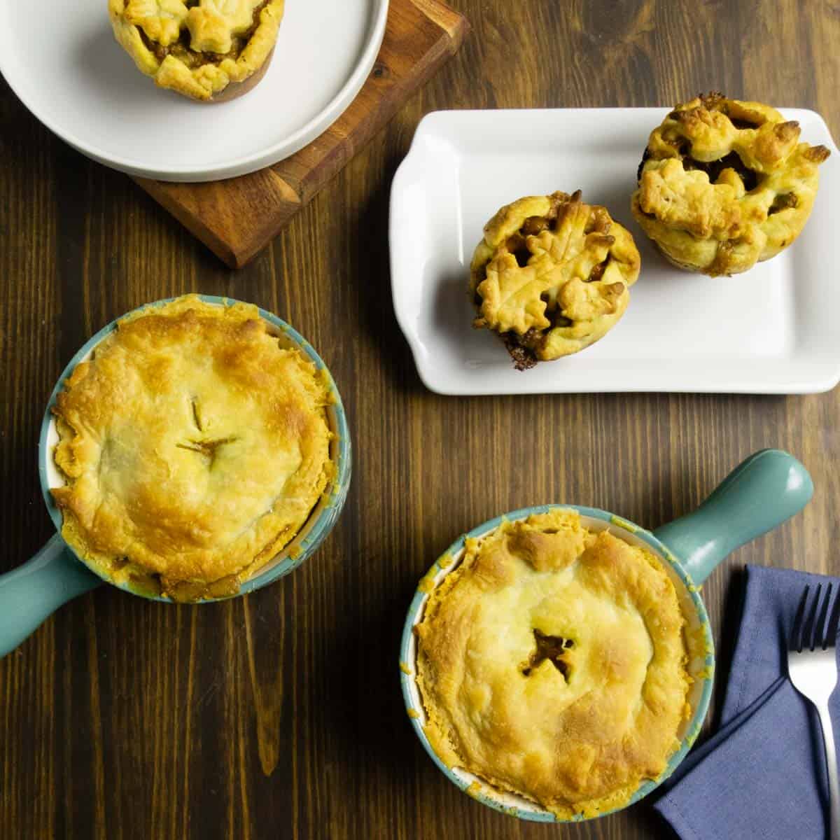 Mini chicken pit pies in a ramakin and on a plate that were made in muffin tins.