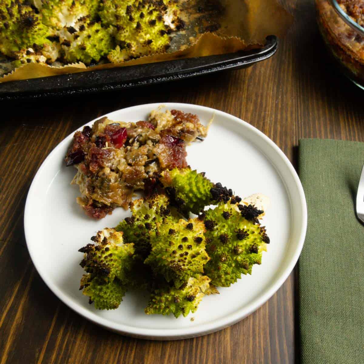 A plate of roasted romanesco with chicken and wild rice casserole.
