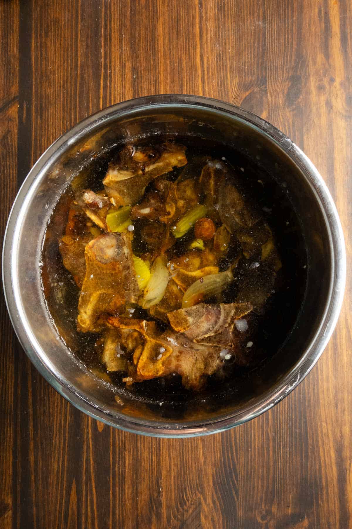 Ingredients in the Instant Pot waiting to be turned into beef stock.