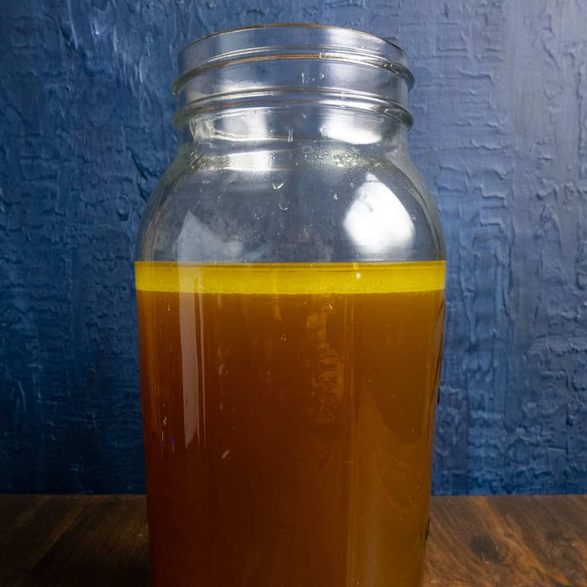 Instant pot beef stock in a half gallon mason jar.