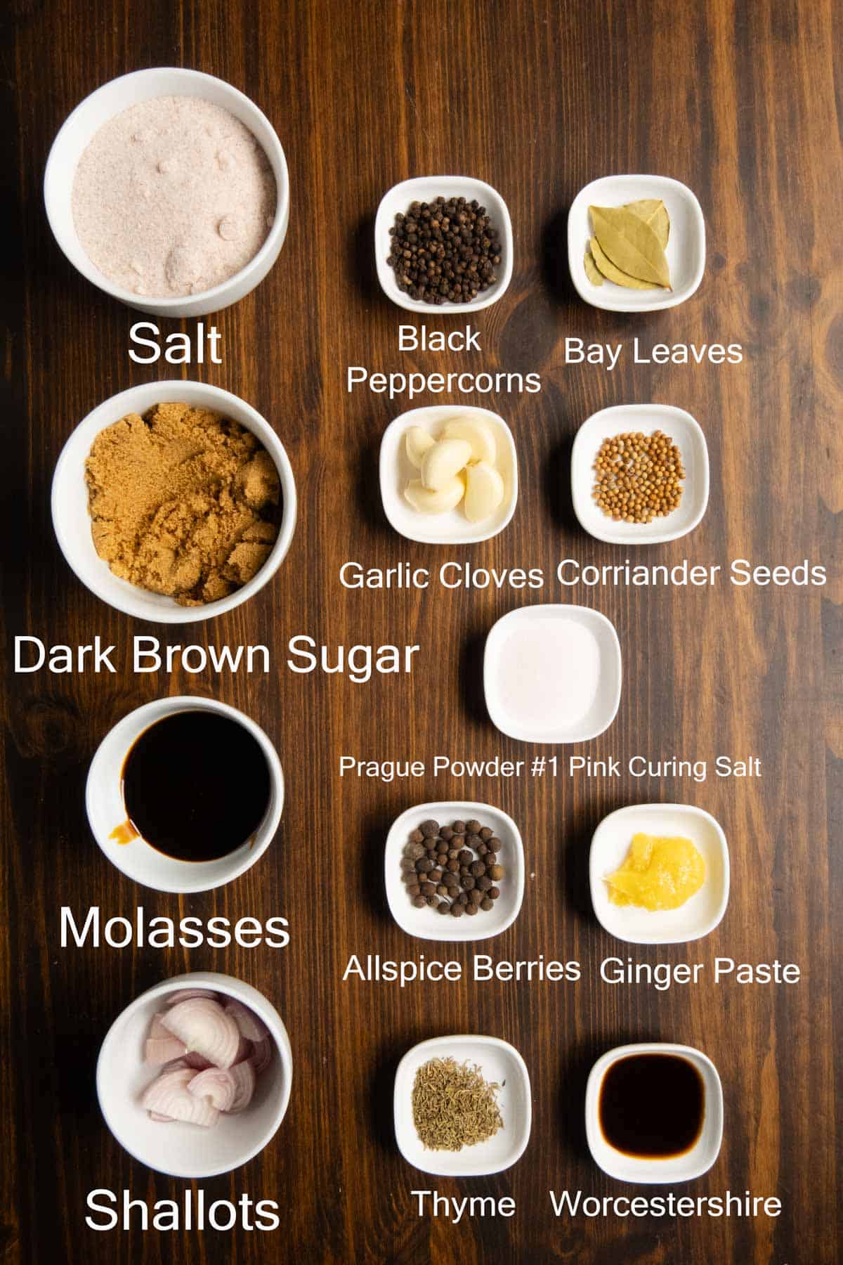 An ingredient shot of salt, curing salt, molasses, spices, and seasonings.
